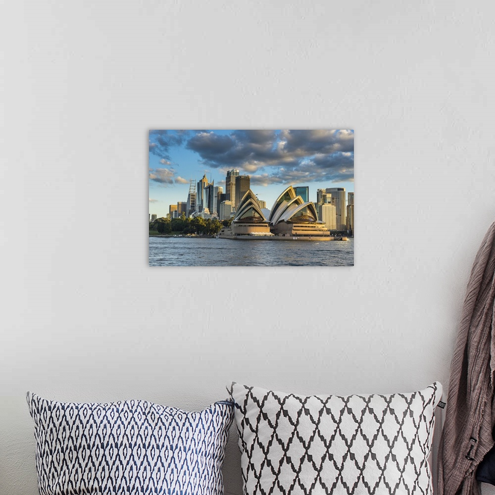 A bohemian room featuring The Sydney Opera House, and skyline of Sydney at sunset, New South Wales, Australia