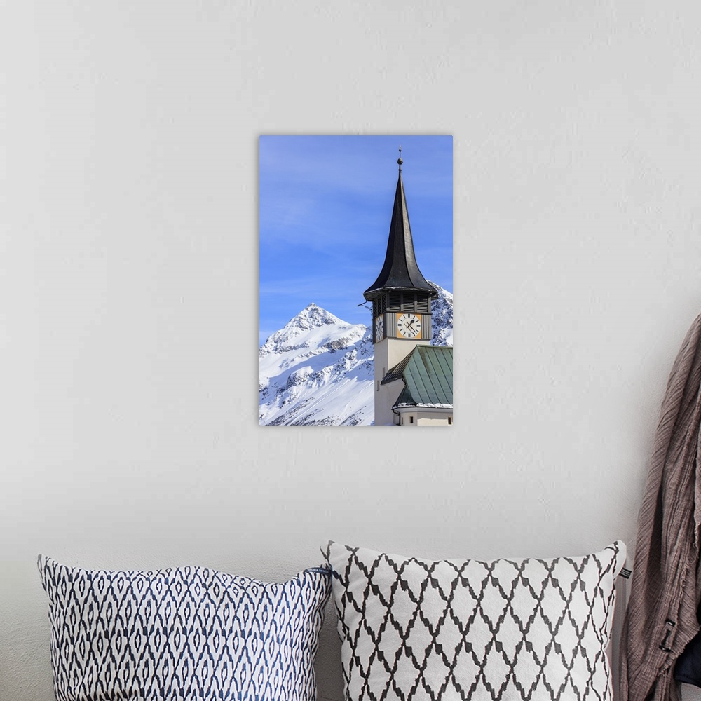 A bohemian room featuring The typical alpine bell tower frames the snowy peaks, Langwies, district of Plessur, Canton of Gr...