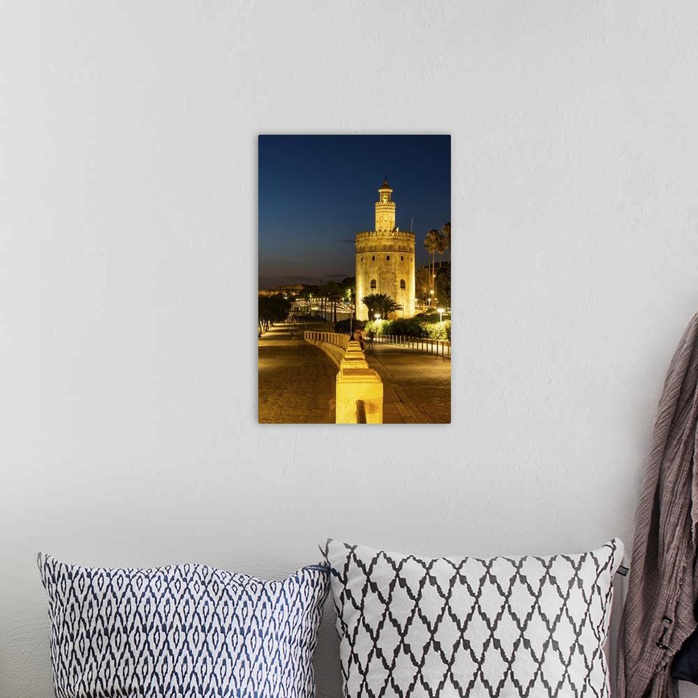 A bohemian room featuring Sunset at Torre del Oro (Tower of Gold), a watchtower on the bank of the Guadalquivir River in Se...