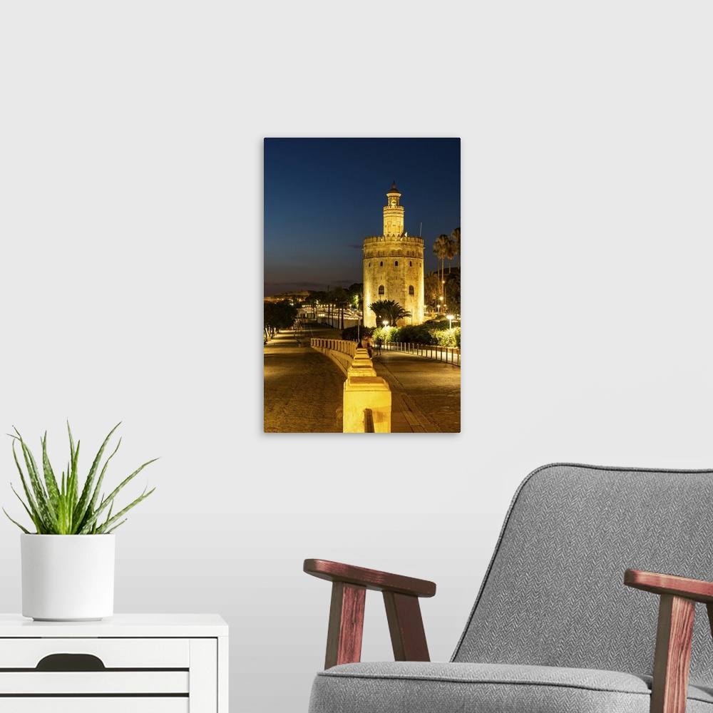 A modern room featuring Sunset at Torre del Oro (Tower of Gold), a watchtower on the bank of the Guadalquivir River in Se...