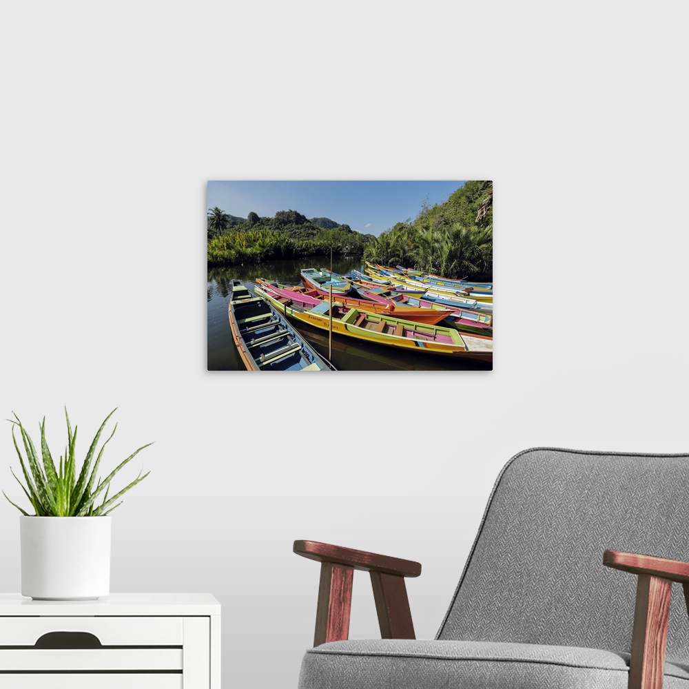 A modern room featuring Tourist tour boats on Pute River in karst limestone region, Rammang-Rammang, Maros, South Sulawes...