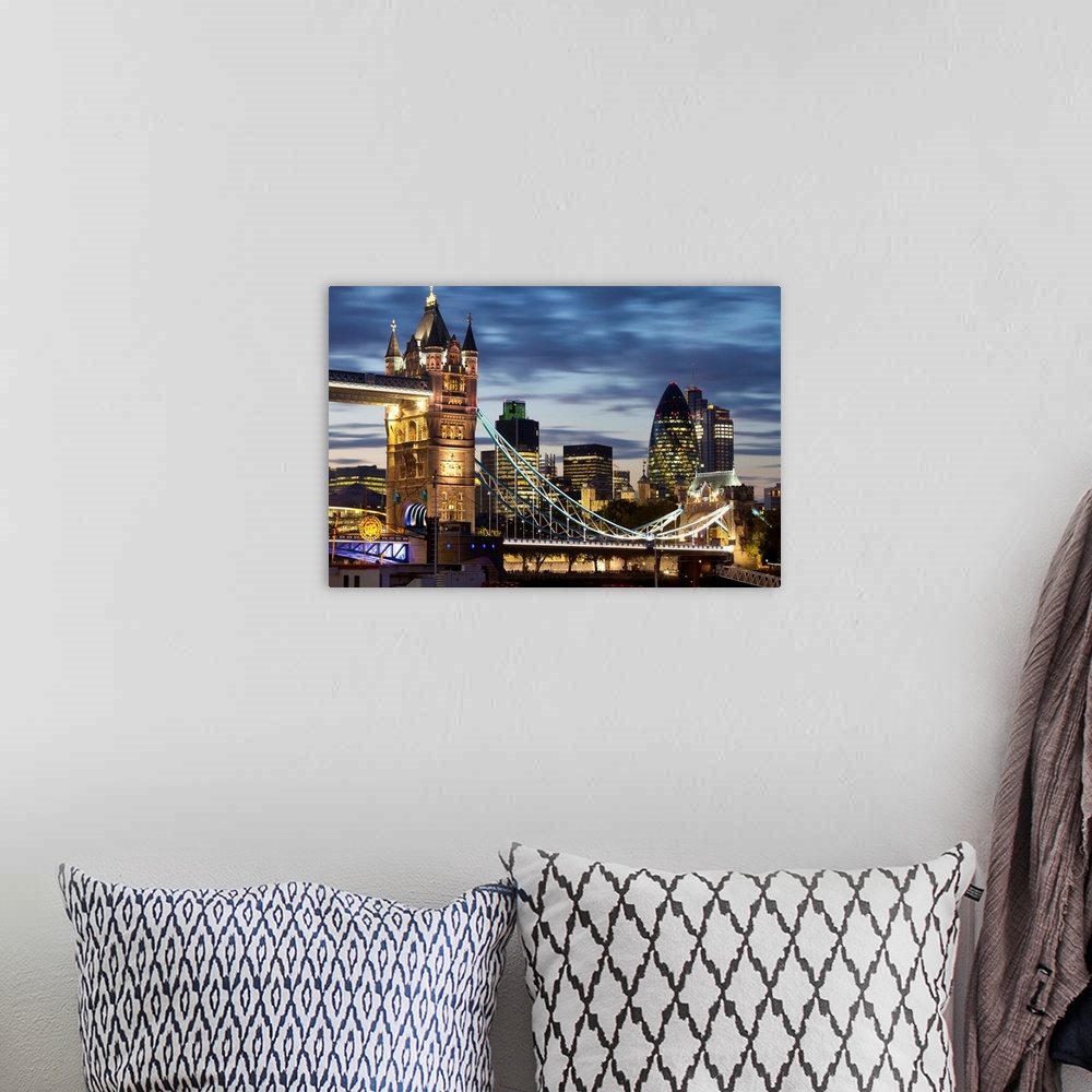 A bohemian room featuring Tower Bridge and the City of London at night, London, England, UK
