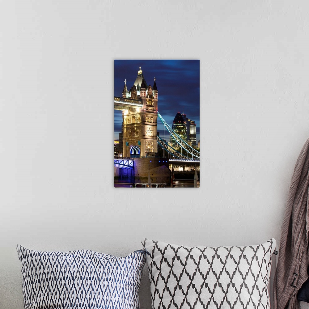 A bohemian room featuring Tower Bridge and the Financial District at night, London, England, UK, Europe