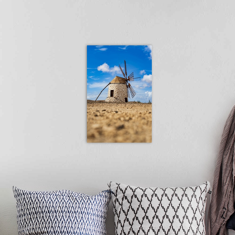 A bohemian room featuring Traditional windmill in the rural landscape of Tefia, Fuerteventura, Canary Islands, Spain, Atlan...