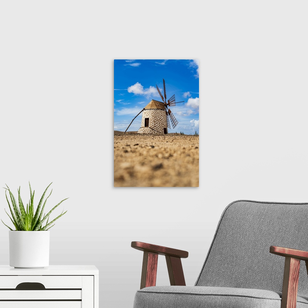 A modern room featuring Traditional windmill in the rural landscape of Tefia, Fuerteventura, Canary Islands, Spain, Atlan...
