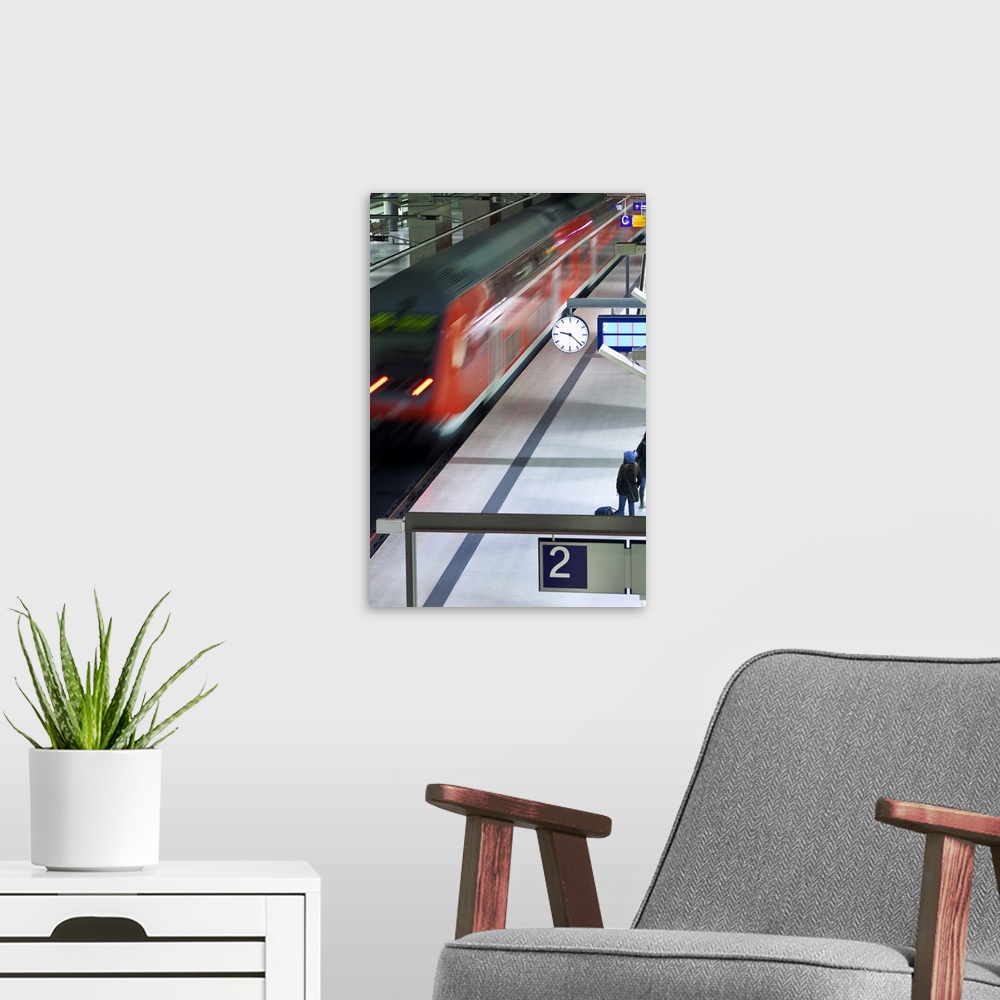 A modern room featuring Train pulling into the platform at new modern main railway station, Berlin, Germany, Europe