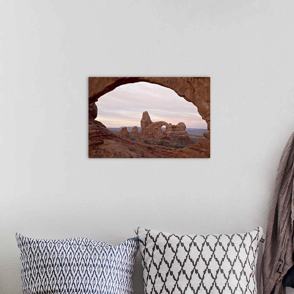 A bohemian room featuring Turret Arch through North Window at dawn, Arches National Park, Utah