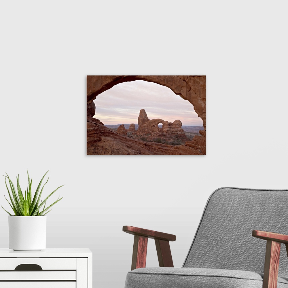 A modern room featuring Turret Arch through North Window at dawn, Arches National Park, Utah