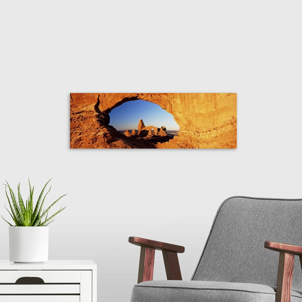 A modern room featuring Turret Arch through North Window at sunrise, Arches National Park, Moab, Utah