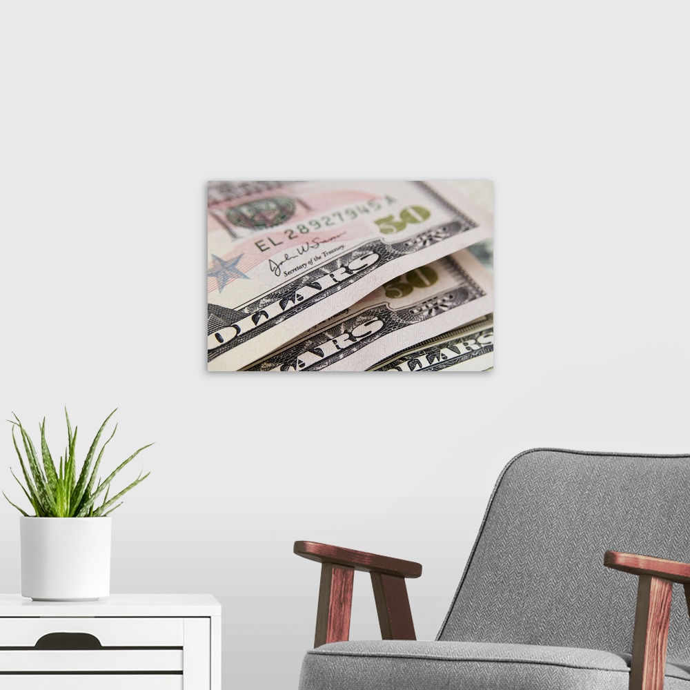 A modern room featuring US currency, 50 and 20 dollar bills