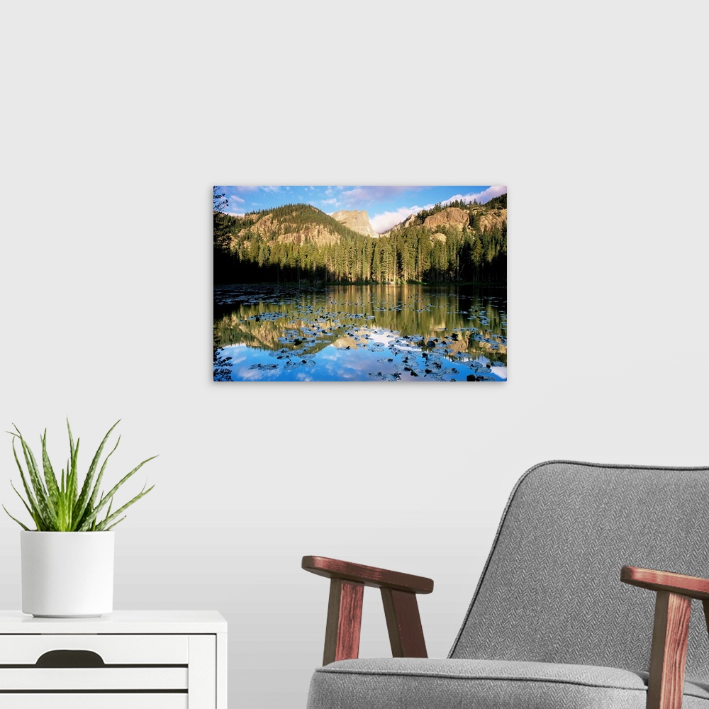 A modern room featuring View across Nymph Lake at sunrise, with Hallett Peak above the trees, Rocky Mountain National Par...