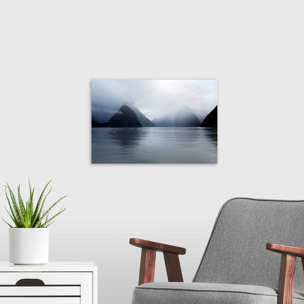 A modern room featuring View down rainswept Milford Sound, mountains obscured by cloud, Milford Sound, Fiordland National...