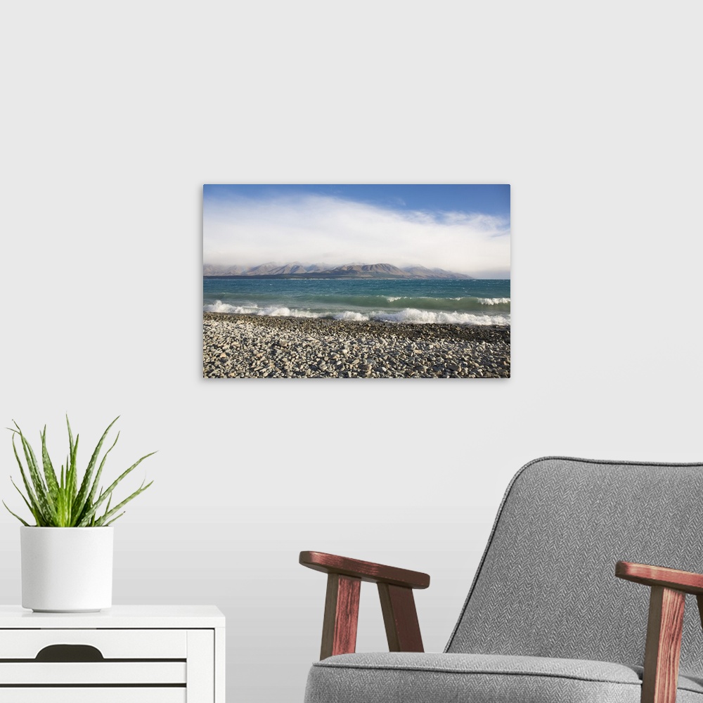 A modern room featuring View from rocky shoreline across the stormy waters of Lake Pukaki, near Twizel, Mackenzie distric...