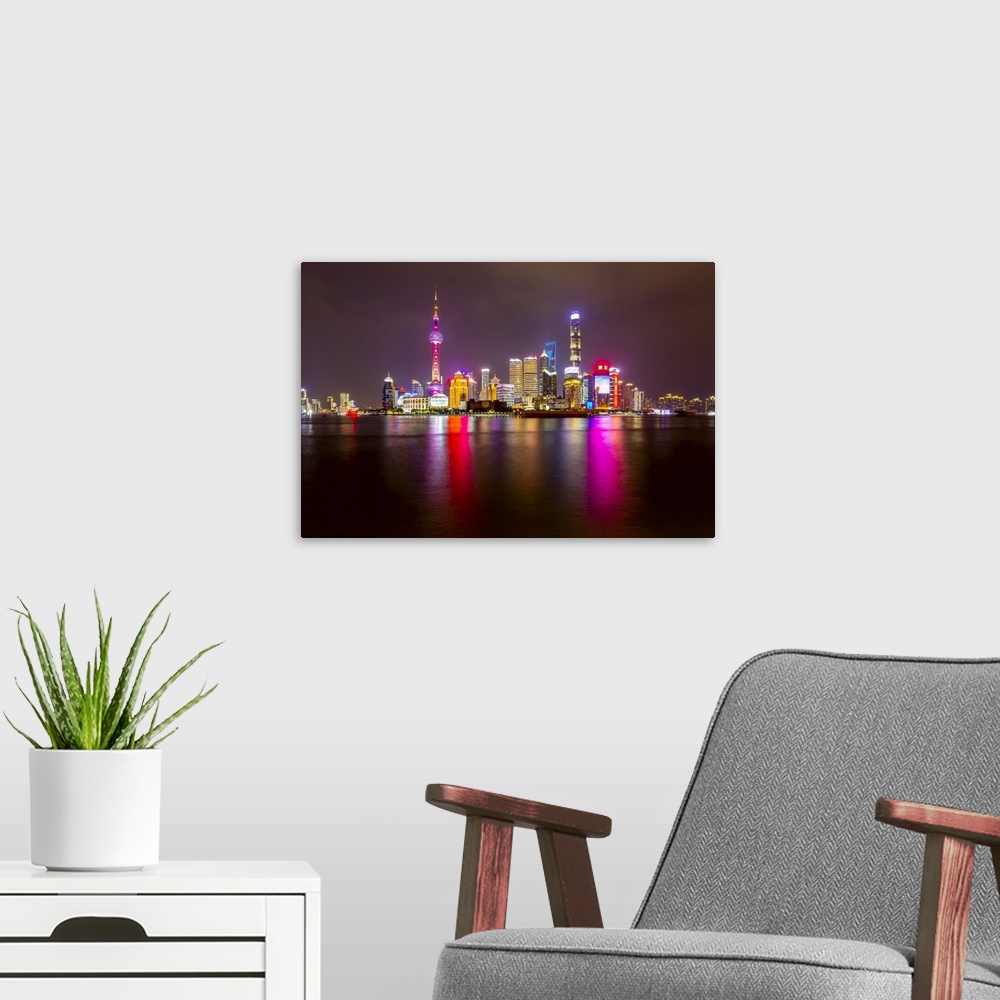 A modern room featuring View of Pudong Skyline and Huangpu River from the Bund, Shanghai, China, Asia