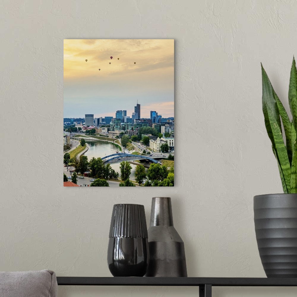 A modern room featuring View over Neris River towards Snipiskes, New City Centre, sunset, Vilnius, Lithuania, Europe