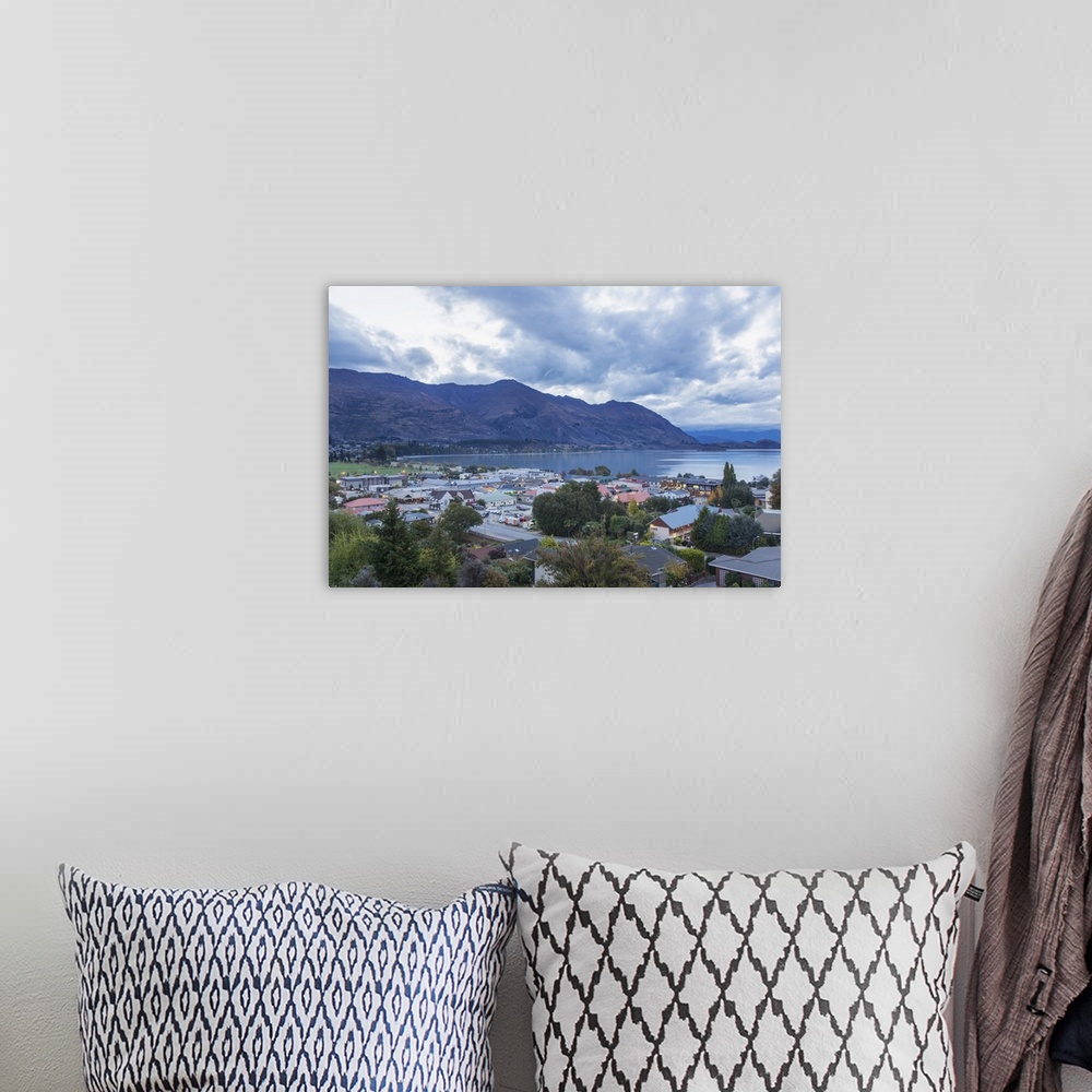 A bohemian room featuring View over rooftops to Lake Wanaka at dusk, Wanaka, Queenstown-Lakes district, Otago, South Island...
