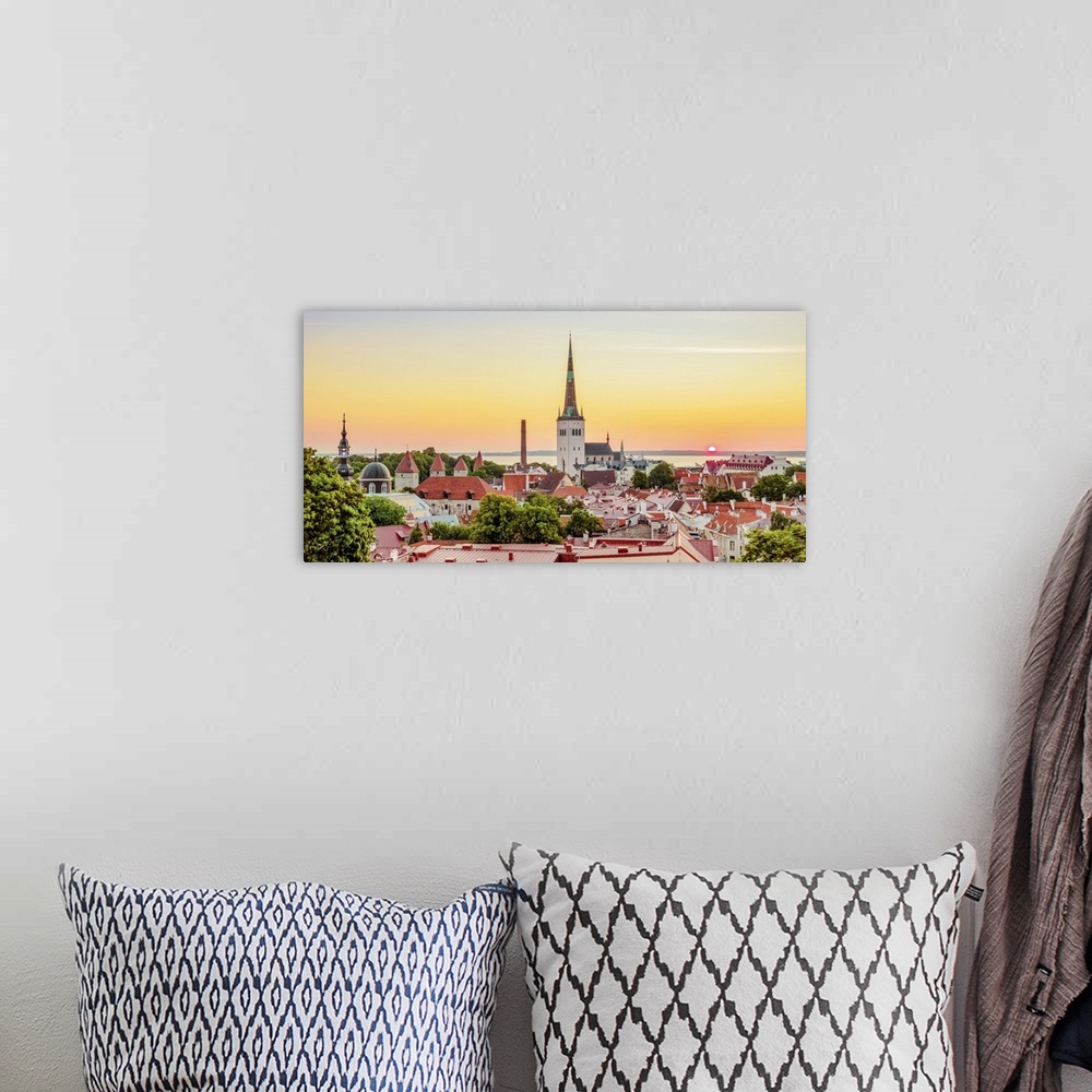 A bohemian room featuring View over the Old Town towards St. Olaf's Church at sunrise, UNESCO World Heritage Site, Tallinn,...