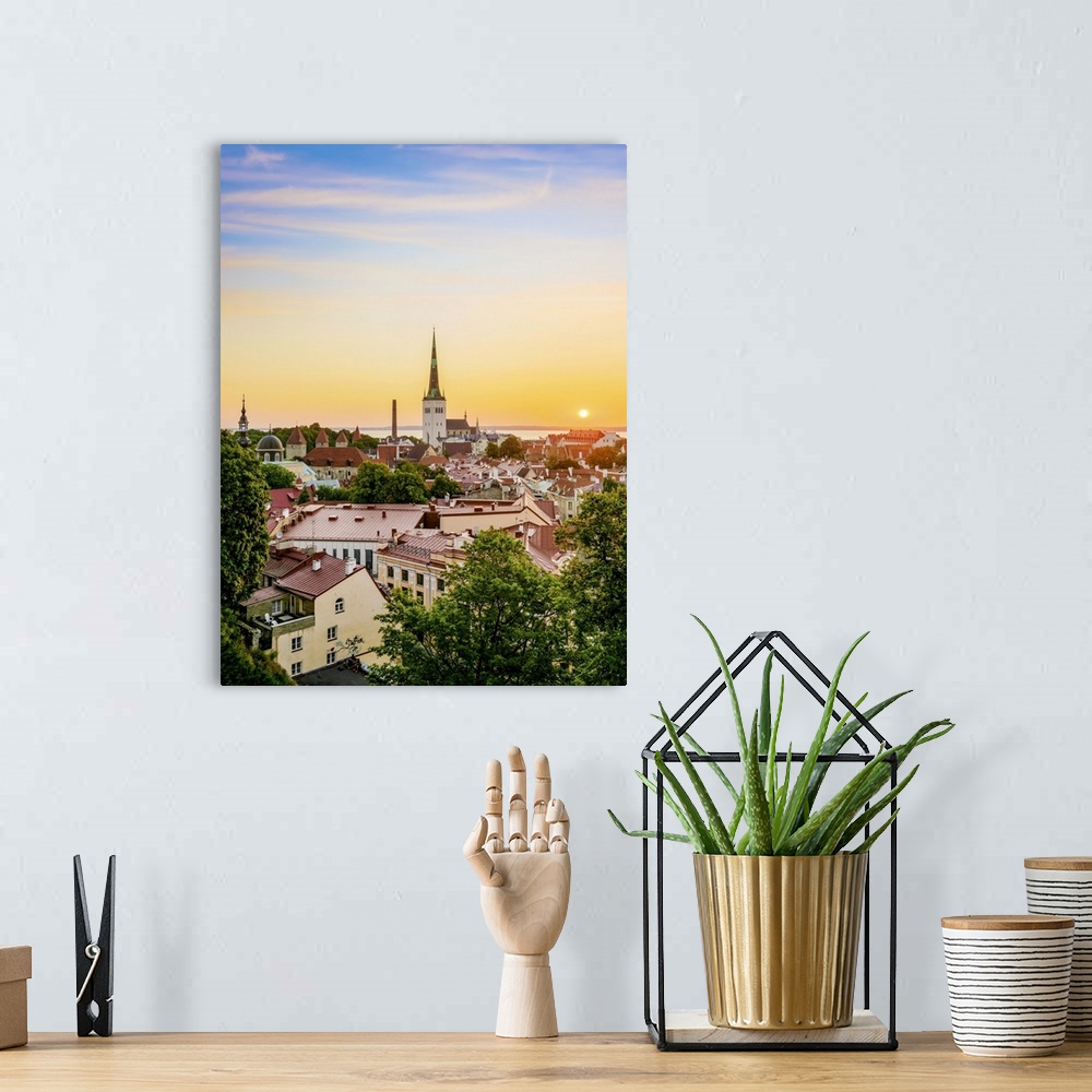 A bohemian room featuring View over the Old Town towards St. Olaf's Church at sunrise, UNESCO World Heritage Site, Tallinn,...