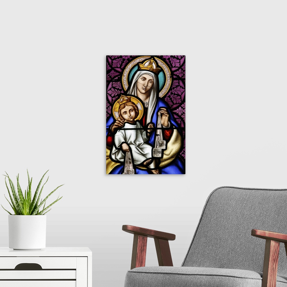 A modern room featuring Virgin and Child, stained glass in Pont L'Abbe church, Brittany, France