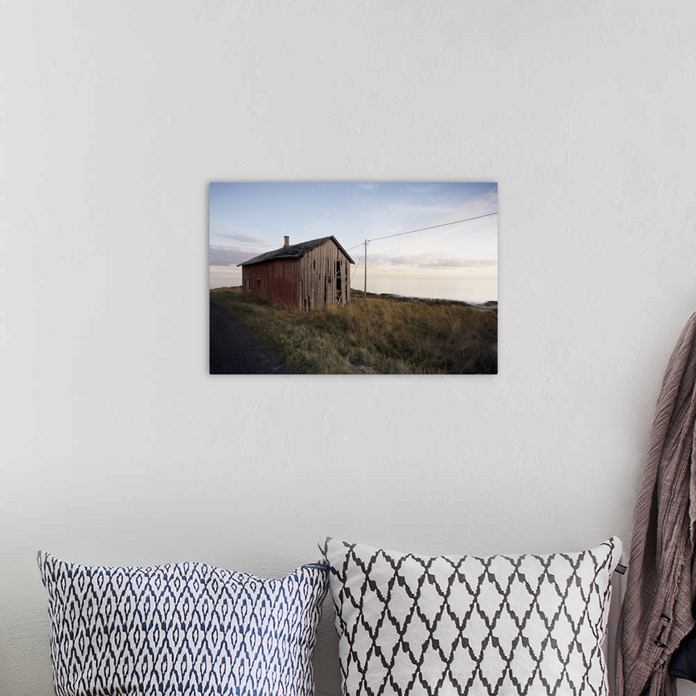 A bohemian room featuring Weathered barn on coast, Lofoten Islands, Norway, Scandinavia, Europe