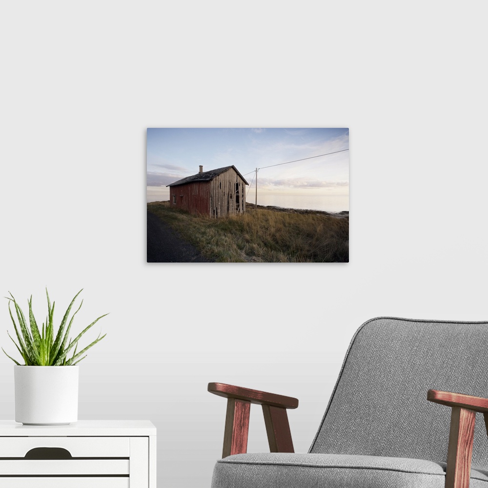A modern room featuring Weathered barn on coast, Lofoten Islands, Norway, Scandinavia, Europe