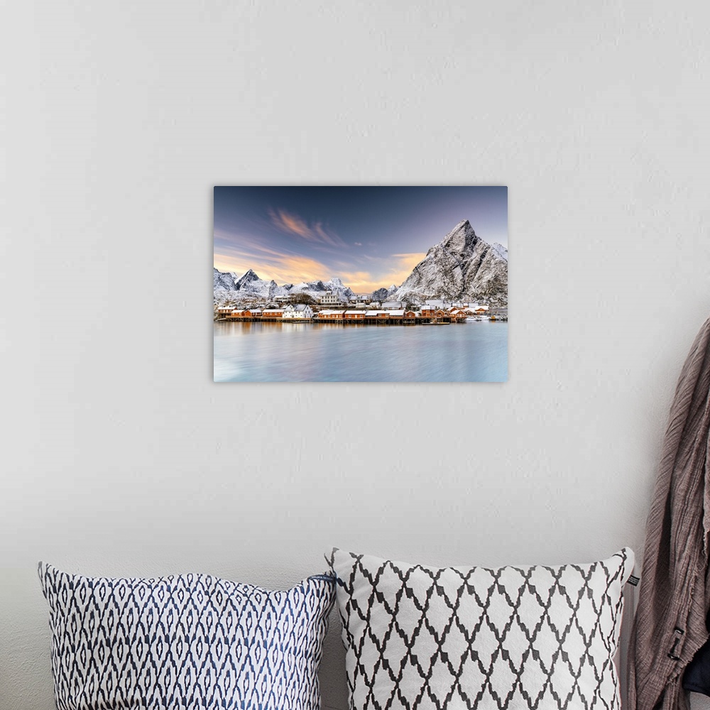 A bohemian room featuring Winter sunset over snowcapped mountains and Sakrisoy village by the frozen sea, Reine, Nordland, ...