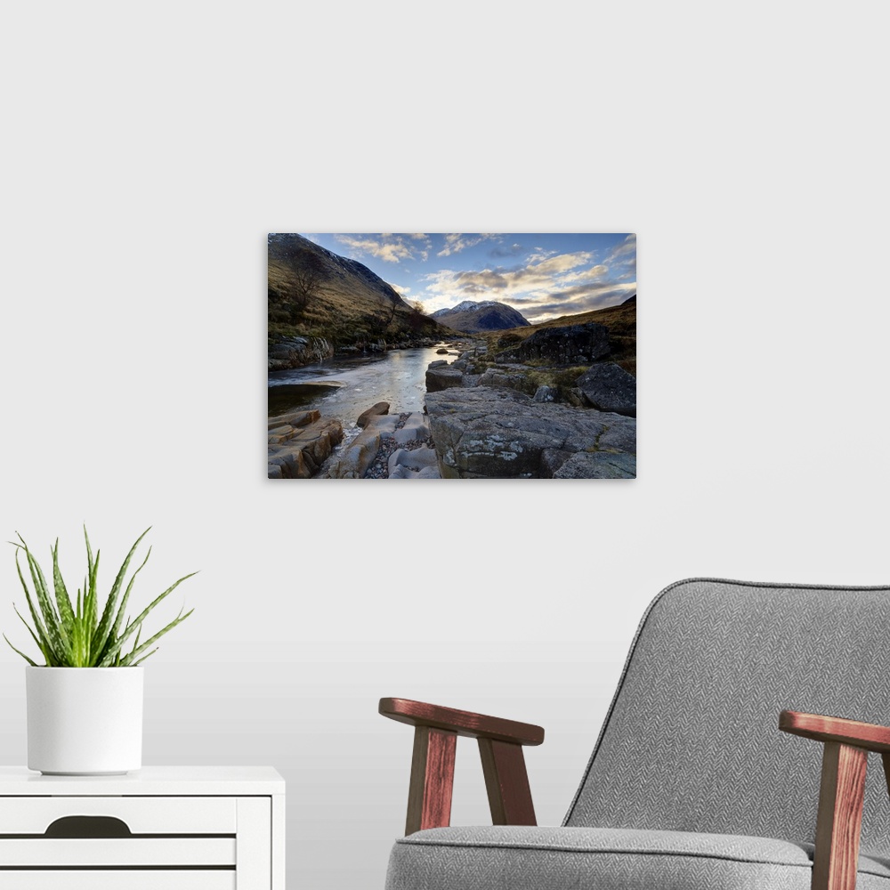 A modern room featuring Winter view along partly-frozen River Etive towards distant mountains, Scotland