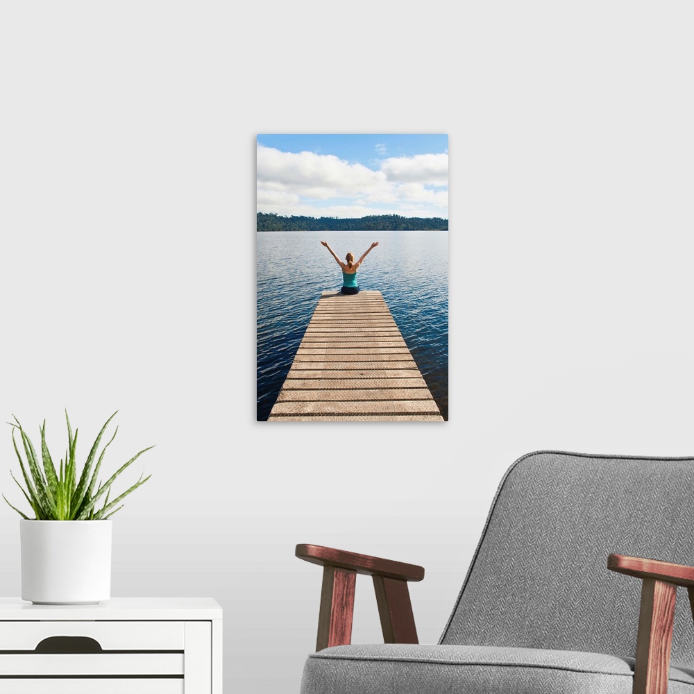 A modern room featuring Woman sitting on a jetty, Lake Ianthe, West Coast, South Island, New Zealand, Pacific