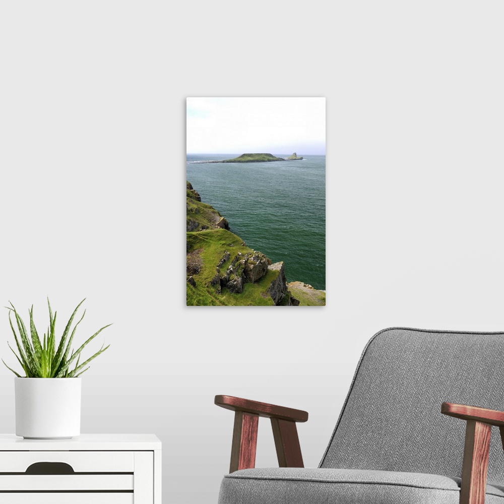 A modern room featuring Worm's head peninsula, Rhossili Bay, The Gower, Wales, UK