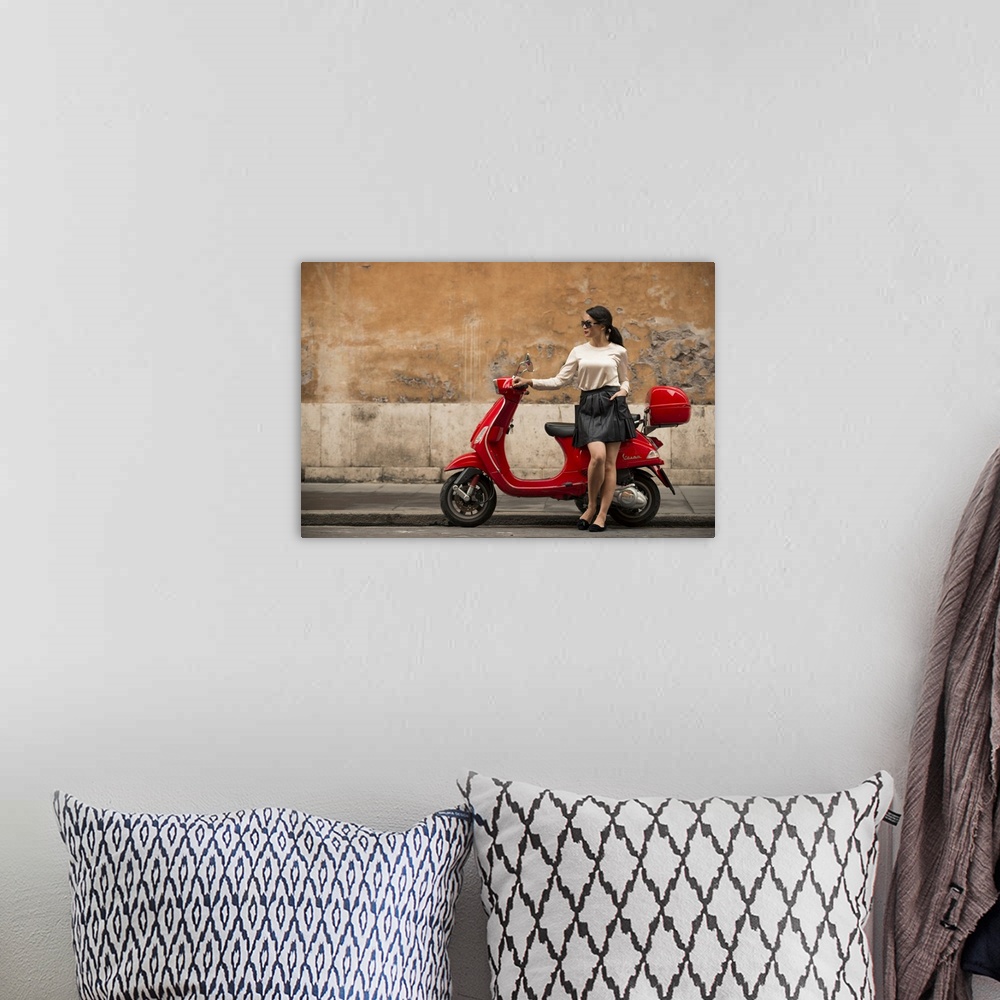 A bohemian room featuring Young woman waiting by Vespa moped, Rome, Lazio, Italy, Europe