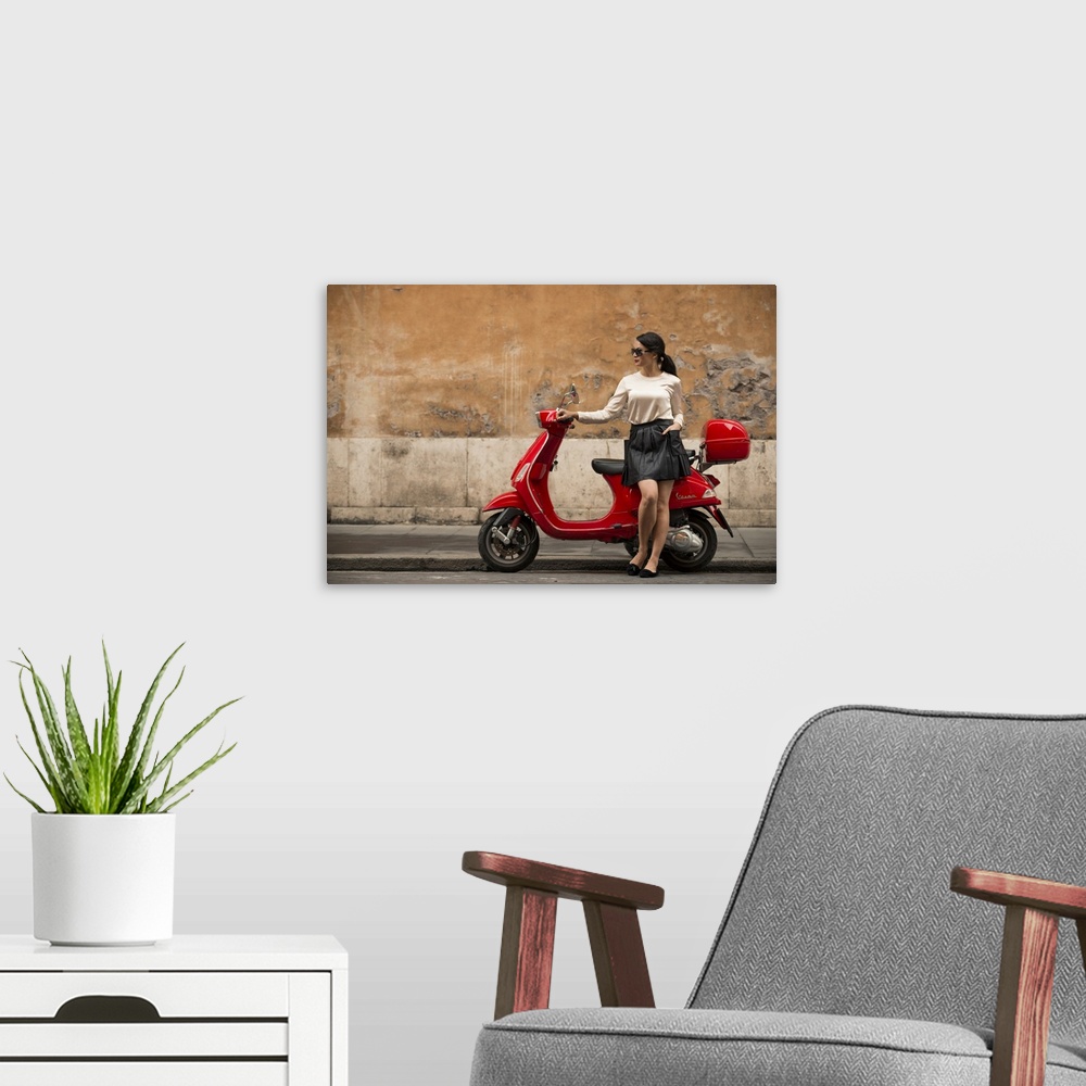 A modern room featuring Young woman waiting by Vespa moped, Rome, Lazio, Italy, Europe
