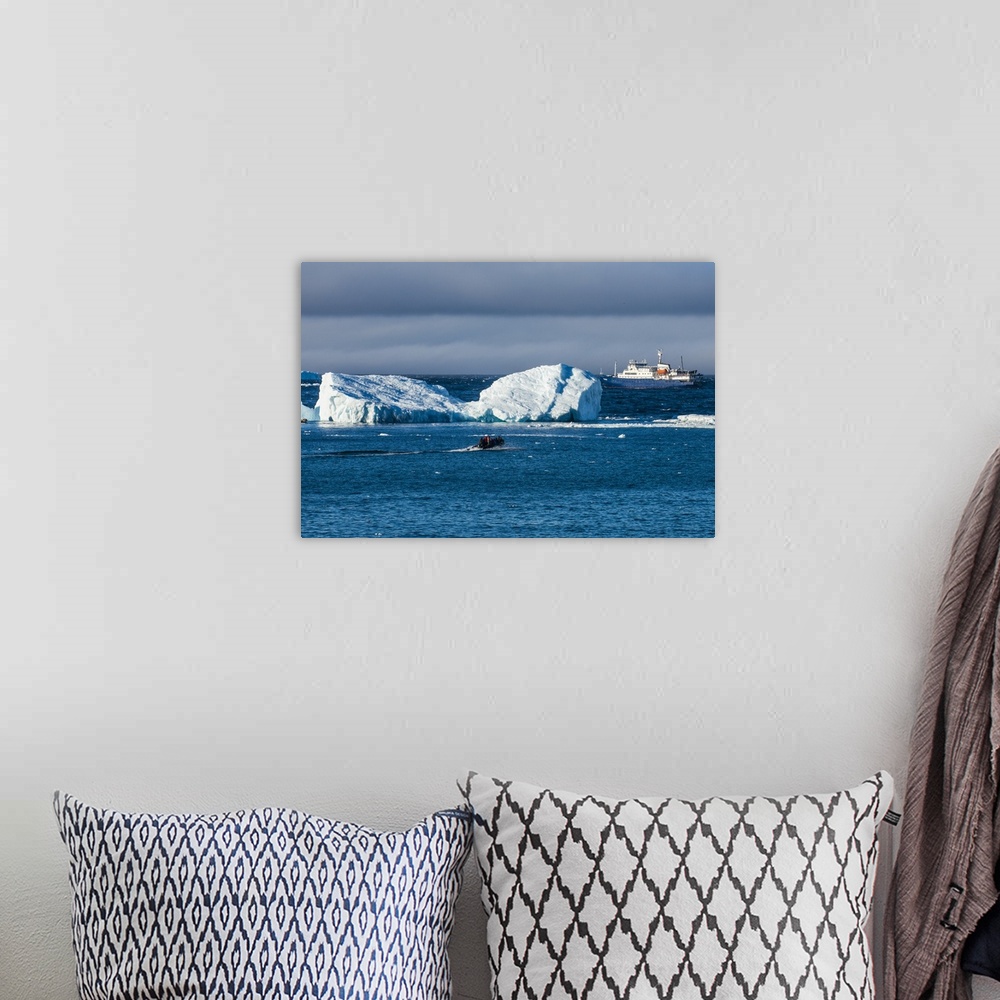 A bohemian room featuring Zodiac cruising back to a cruise ship anchoring behind an iceberg, Brown Bluff, Antarctica, Polar...