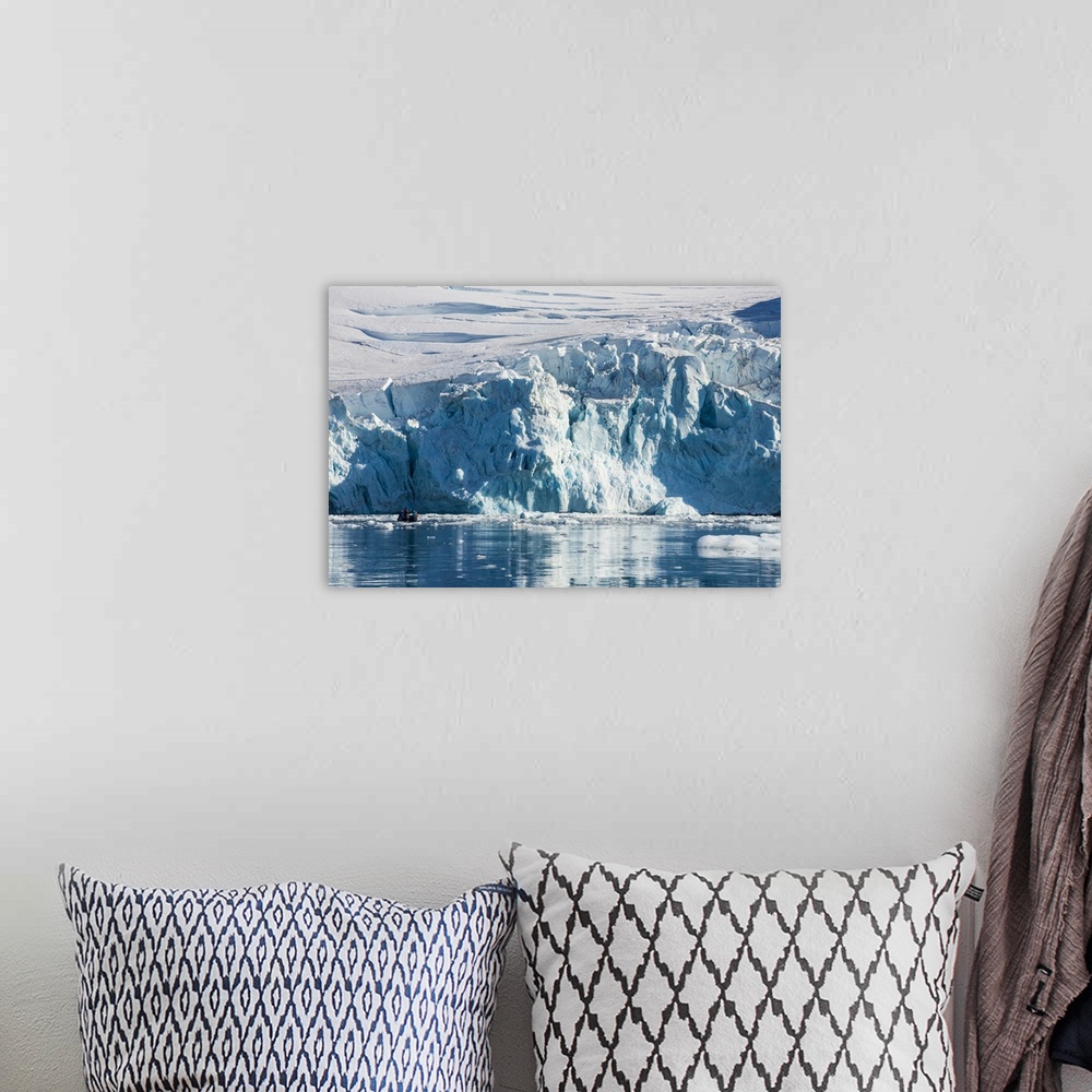 A bohemian room featuring Zodiac with tourists cruising in front of a huge glacier, Hope Bay, Antarctica, Polar Regions