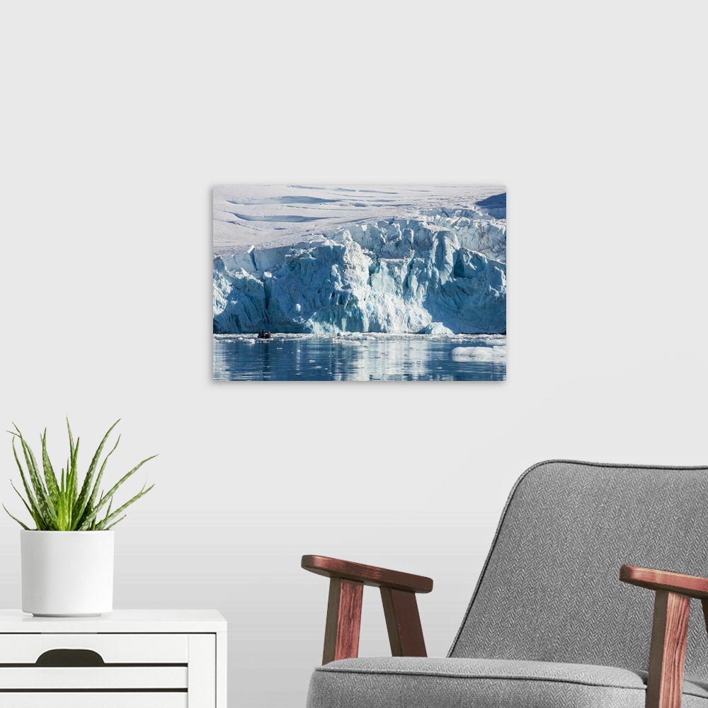 A modern room featuring Zodiac with tourists cruising in front of a huge glacier, Hope Bay, Antarctica, Polar Regions