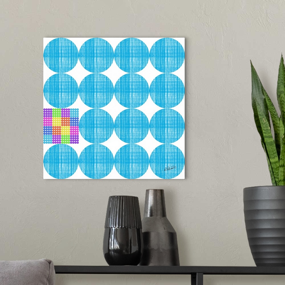 A modern room featuring Rows of blue circles in a cross hatching pattern with one multi-colored square.