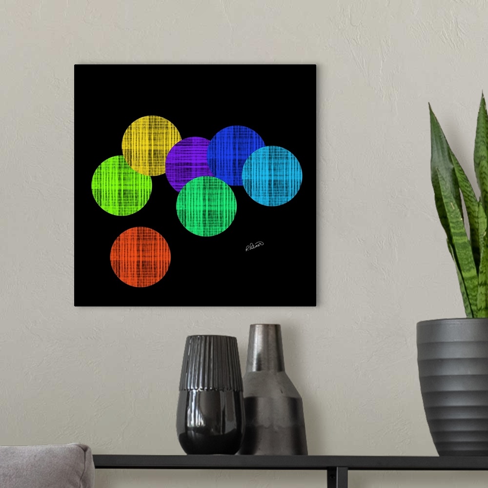 A modern room featuring Vibrant colored circles in a cross hatching pattern overlapping each other on a black backdrop.