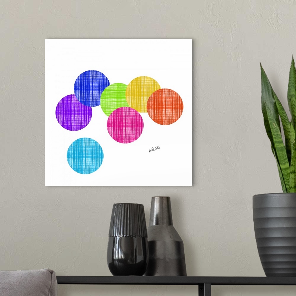 A modern room featuring Vibrant colored circles in a cross hatching pattern overlapping each other on a white backdrop.