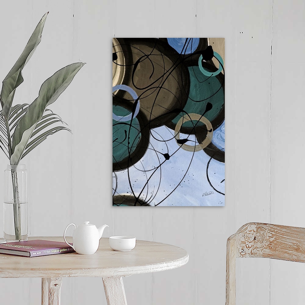 A farmhouse room featuring A contemporary abstract painting using circle and paint drizzle in mute tones.