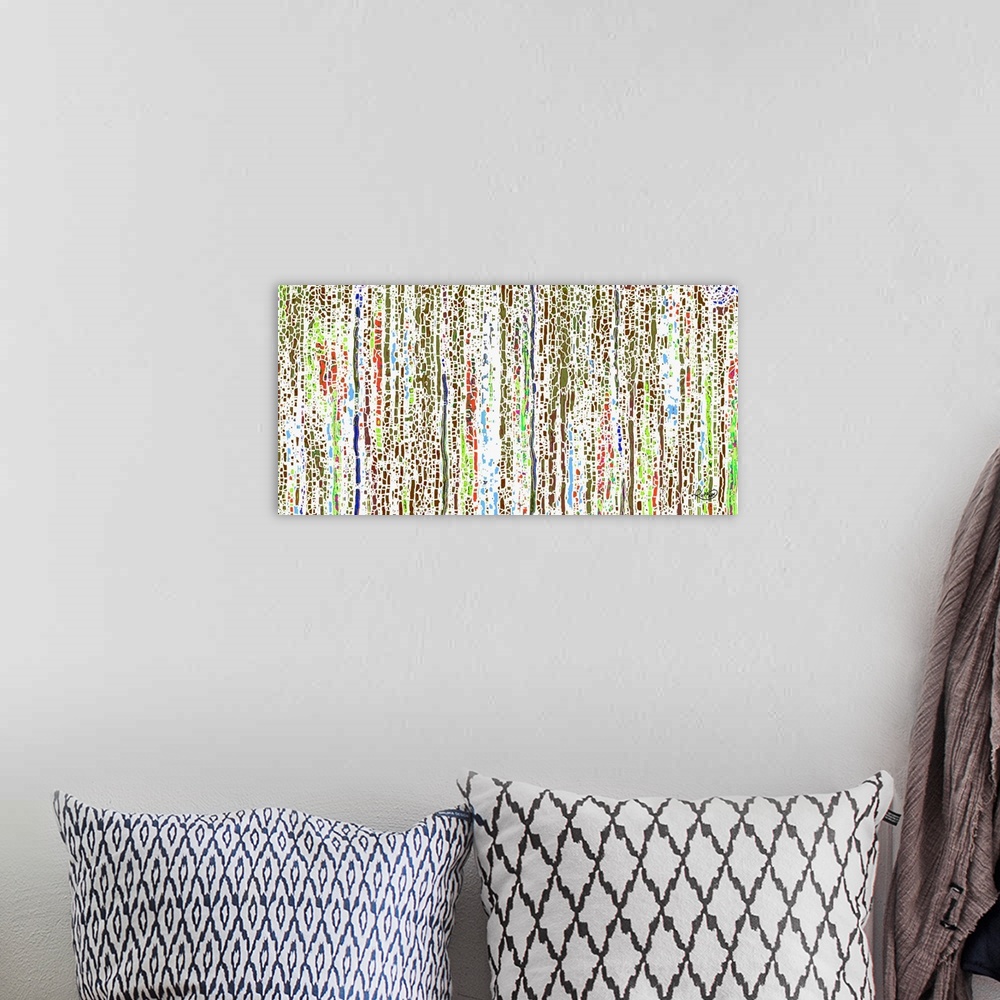 A bohemian room featuring Abstract art that has colorful, broken up, vertical lines on a white background.