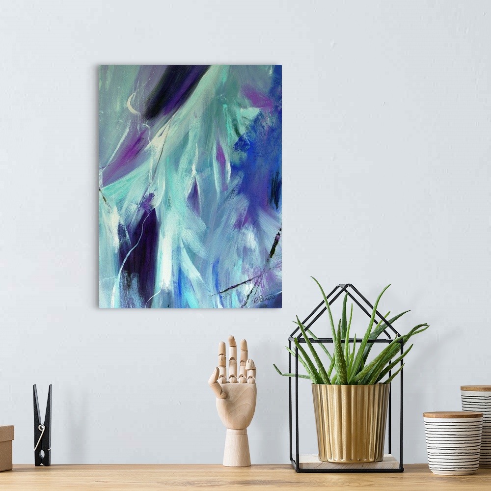 A bohemian room featuring Abstract painting created with shades of blue, purple, black, and white blended together.