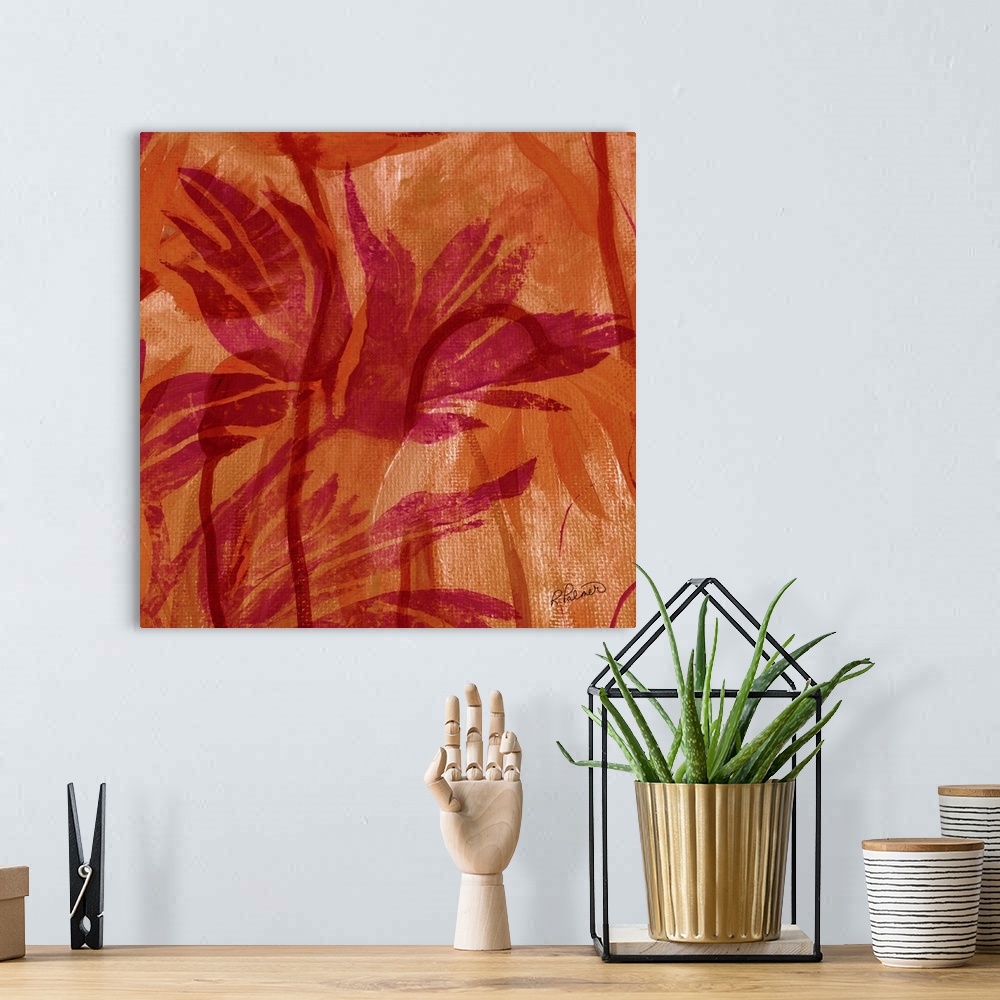 A bohemian room featuring Square decorative painting of pink silhouettes of Fall foliage on an orange background.