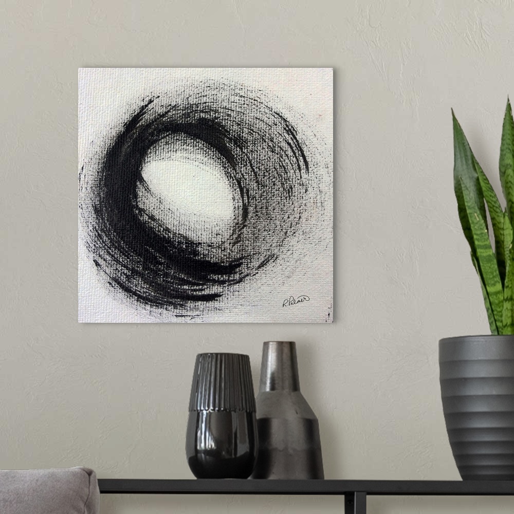 A modern room featuring Square abstract painting with a large circle in the center on a white-gray background.