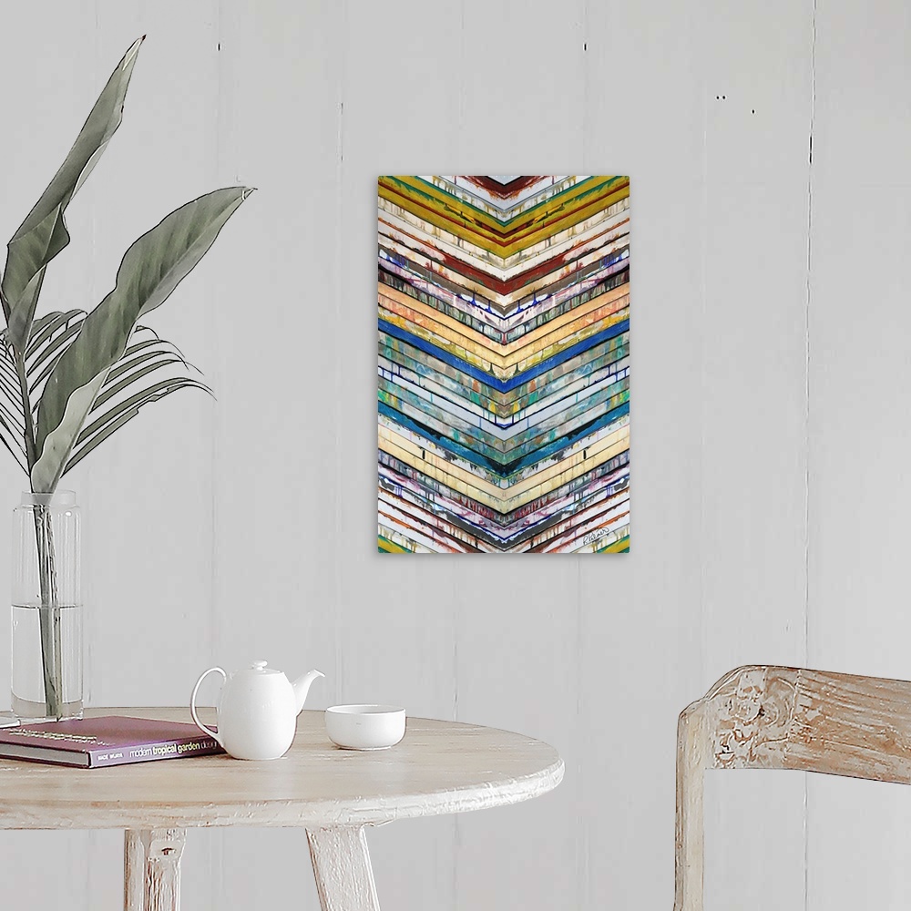 A farmhouse room featuring Contemporary abstract painting of slatted colorful bars in a chevron pattern pointing down.