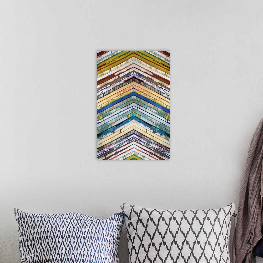 A bohemian room featuring Contemporary abstract painting of slatted colorful bars in a chevron pattern pointing up.