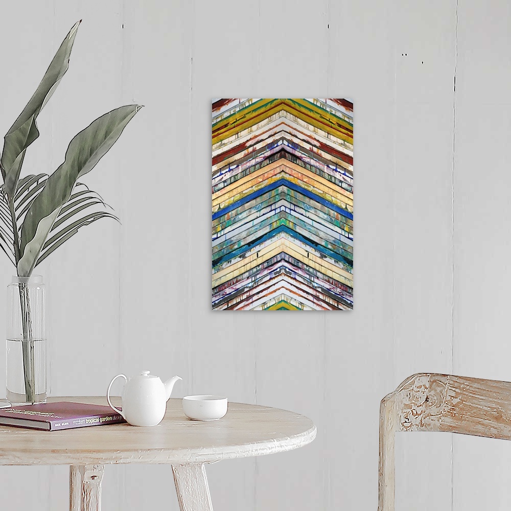 A farmhouse room featuring Contemporary abstract painting of slatted colorful bars in a chevron pattern pointing up.