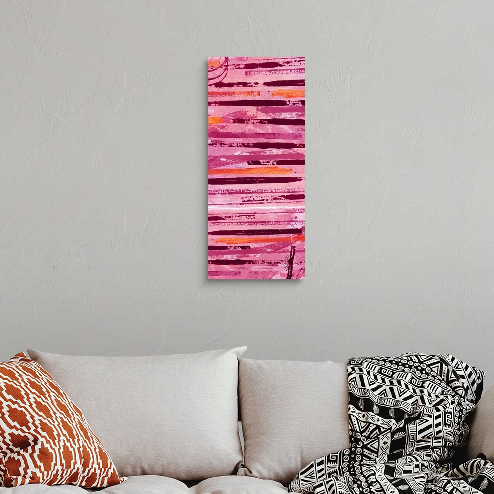 A bohemian room featuring Tall abstract painting with horizontal lines in shades of pink, orange, and red.