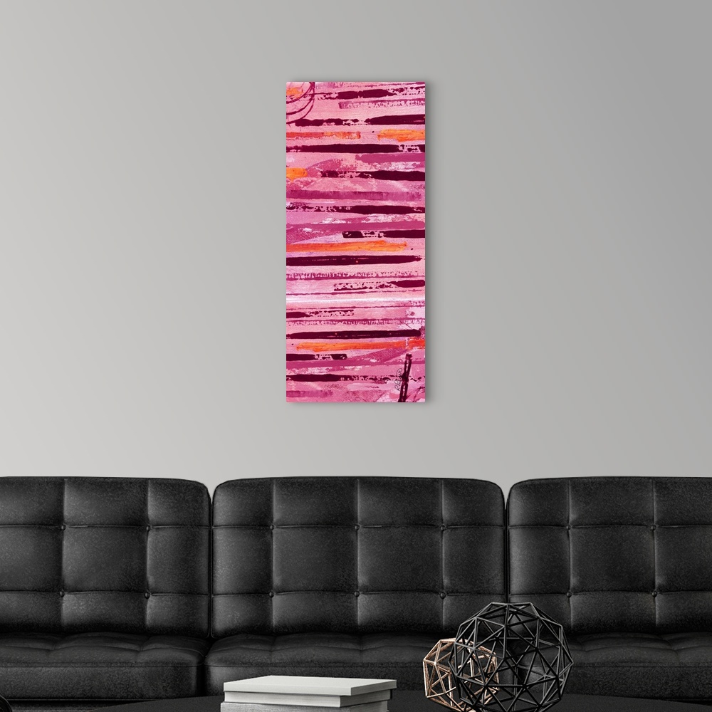 A modern room featuring Tall abstract painting with horizontal lines in shades of pink, orange, and red.
