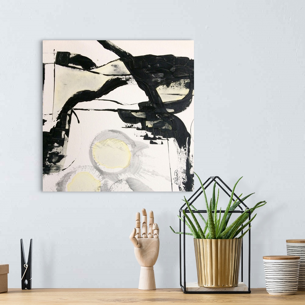 A bohemian room featuring Square abstract painting in black, white, gray, and yellow hues with bold brushstrokes creating m...