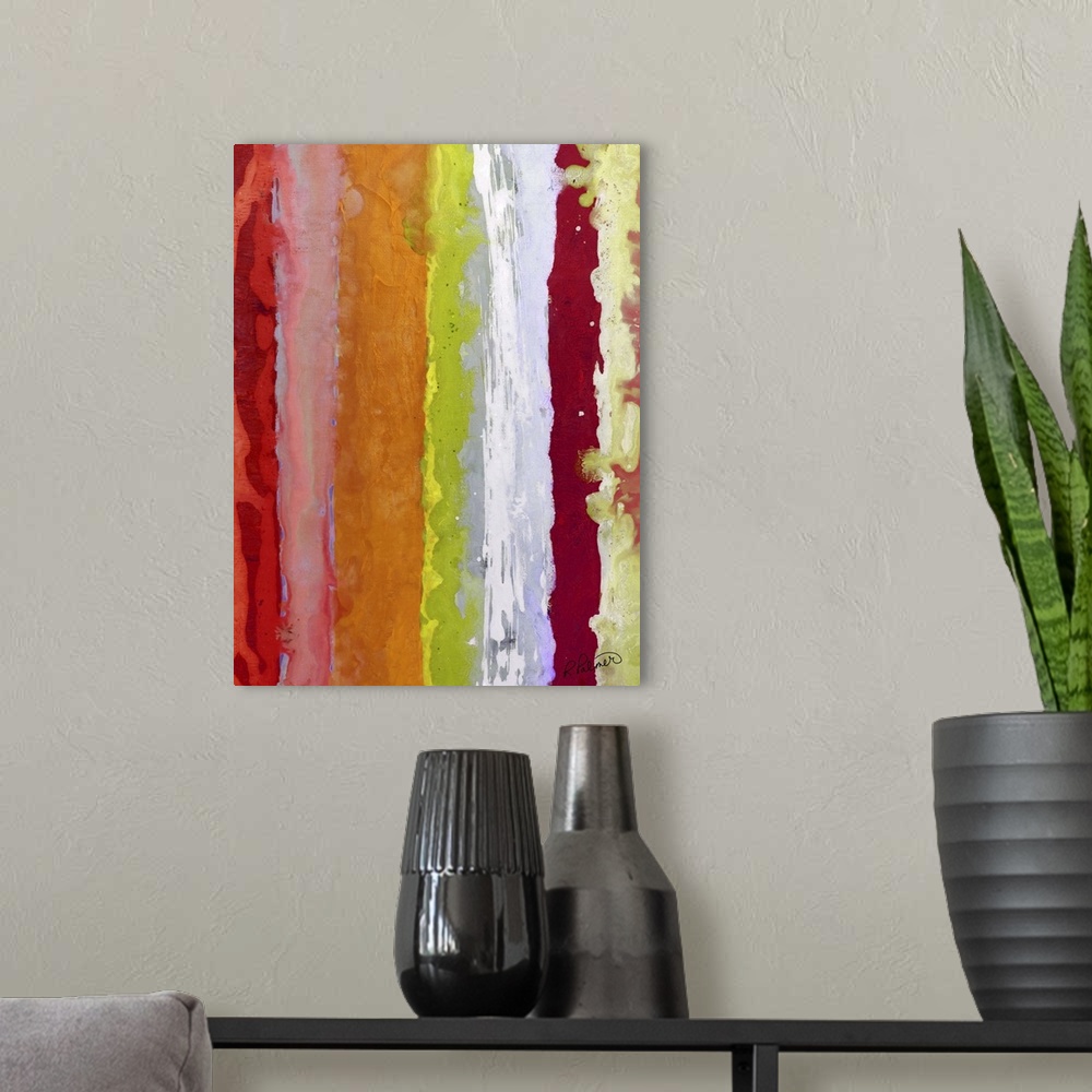 A modern room featuring Colorful abstract painting with vertical bands of color in shades of red, pink, orange, yellow, g...