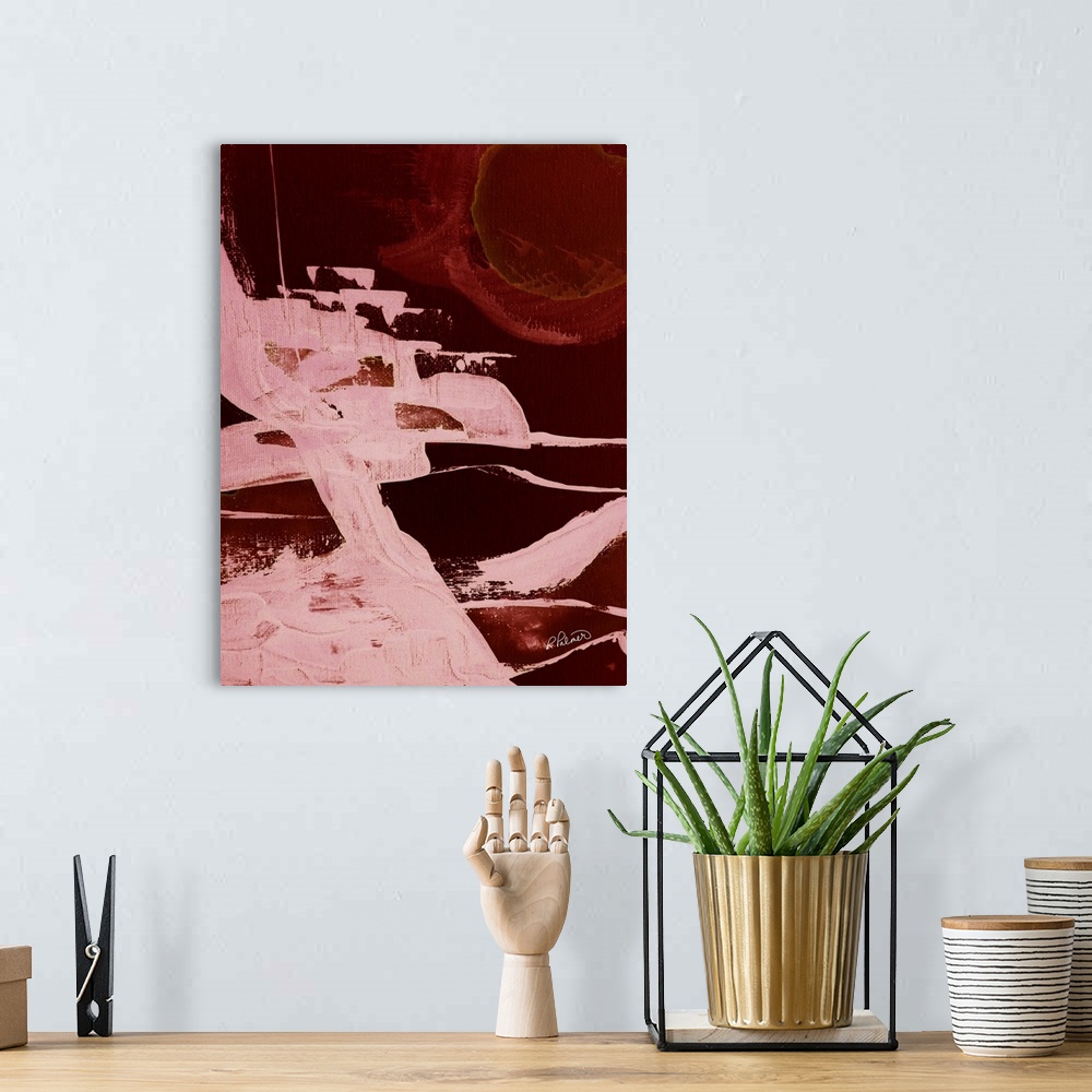 A bohemian room featuring Abstract painting with a bold burnt red background and brighter pink brushstrokes on top.